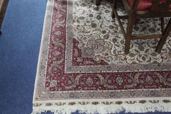 A modern Turkish Tabriz style part silk carpet, 9ft 10in by 6ft 8in.